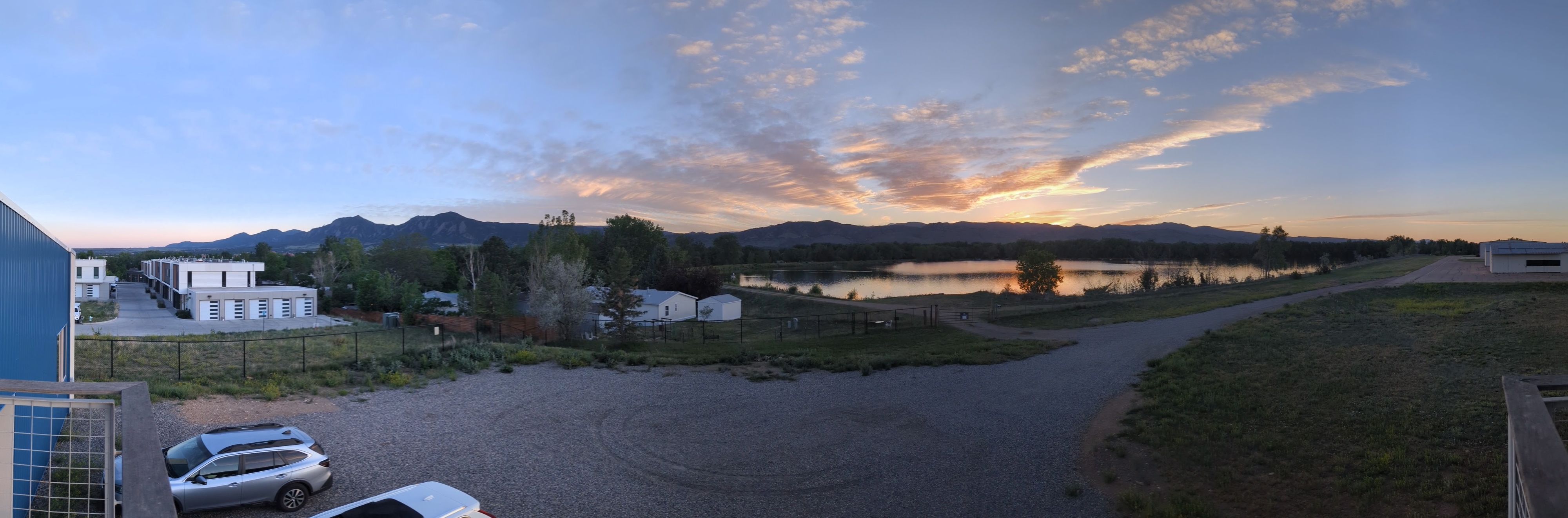 Panorama at dusk across the water toward the Flatirons and the length of the range.